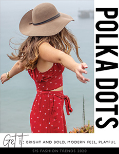 Young fashionable woman wearing red polka dot jumpsuit with tan hat
